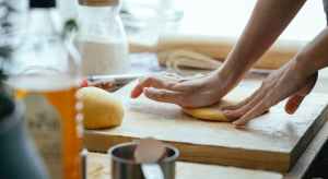 woman kneading dough in kitchen